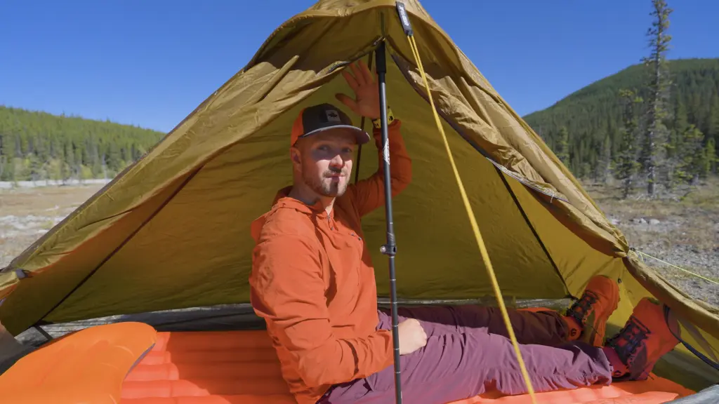 The most headroom is in the middle of the tent, under the peak.