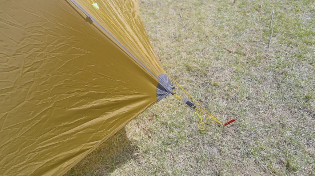 Six stakeout points hold down the bottom edge of the fly.