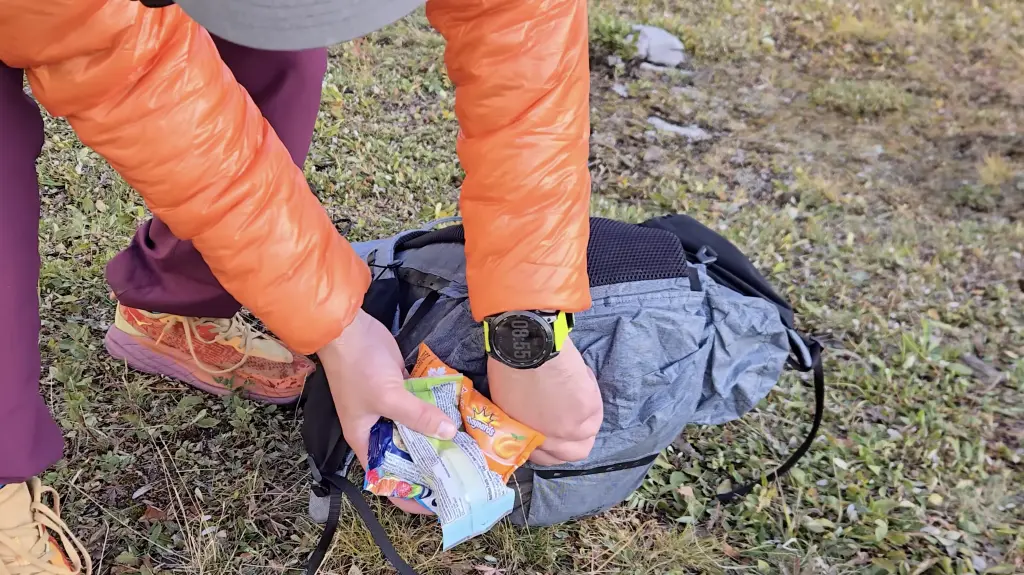 The bottom pocket holds snacks during the day and the wrappers afterward.